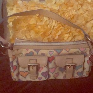 Dooney and Bourke small purse and Nike shoes.